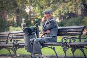 Pandemic aging in place mask on park bench